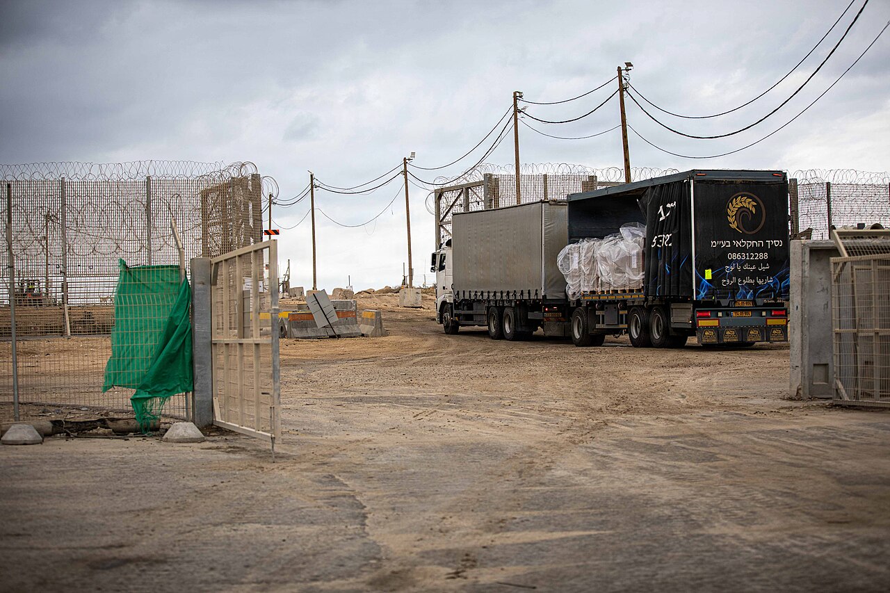 Trucks carrying humanitarian aid staged at the Zikim Crossing Point