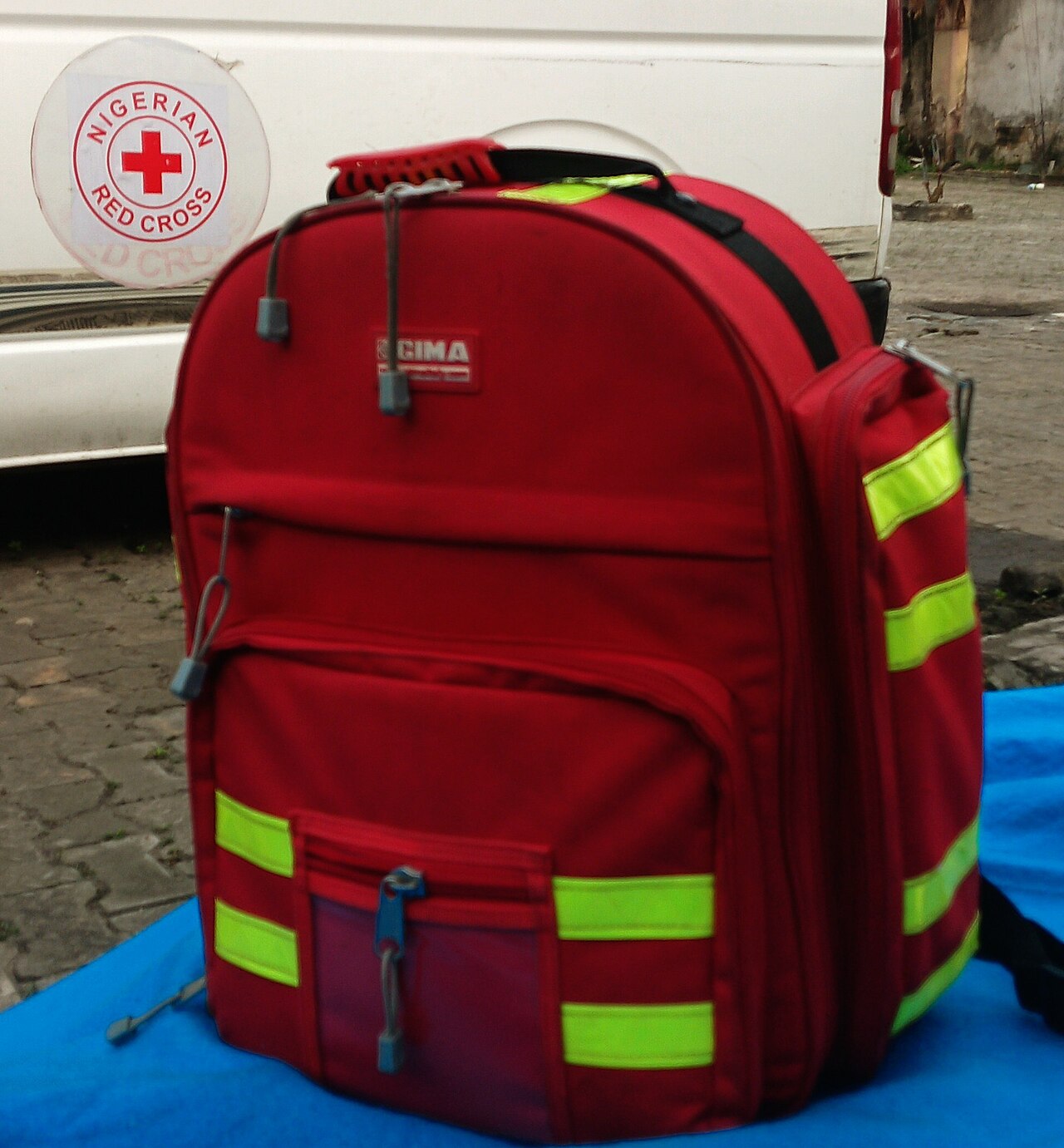A Red Cross emergency response backpack stocked with first aid and medical supplies
