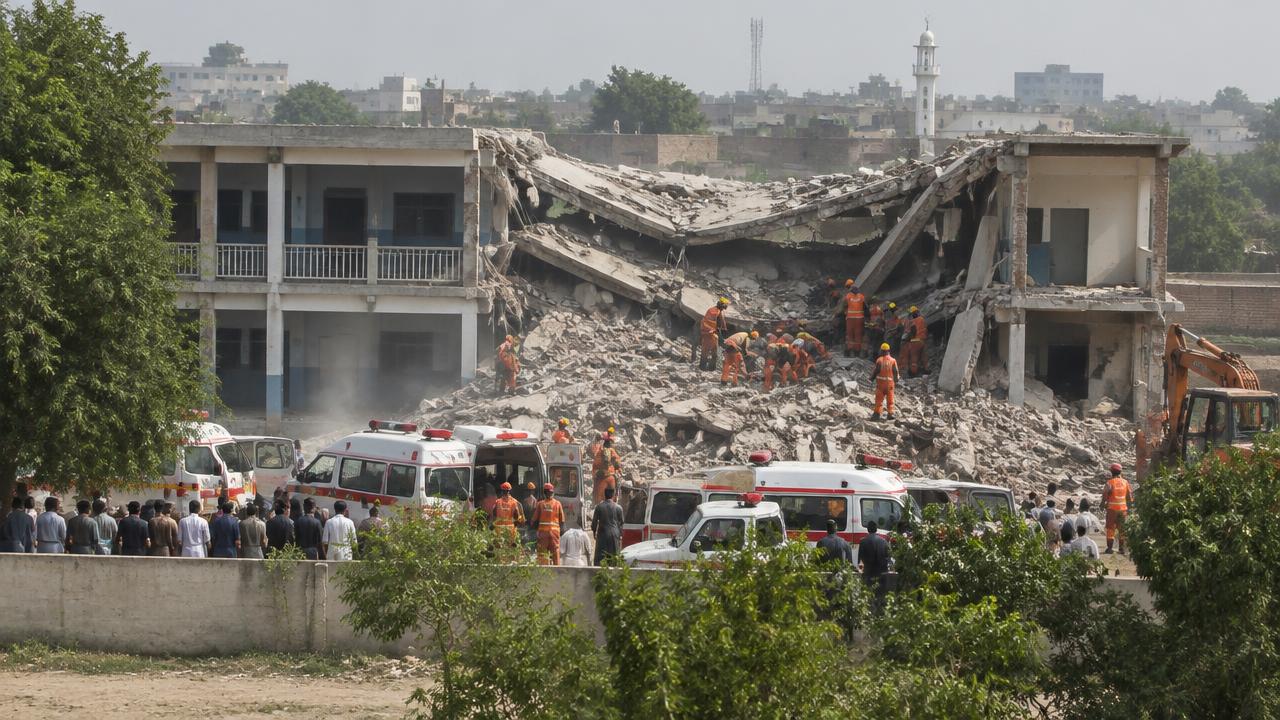 Illustrative rescue workers digging through a collapsed school building