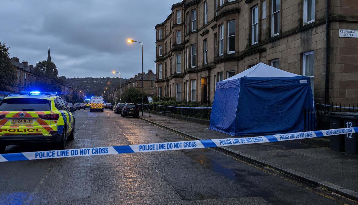 A police cordon and forensic tent on a residential Glasgow street