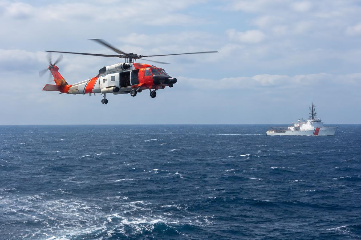 Illustrative rescue helicopter and ship over the Pacific; not the Baja rescue operation