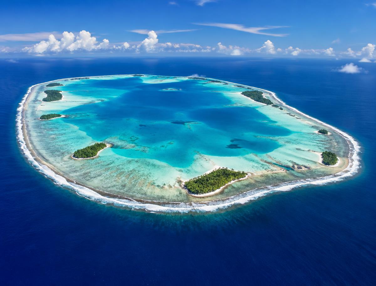 Illustrative aerial image of a Pacific atoll; not a test site